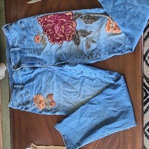 Vintage jeggings with floral designs on the leggs